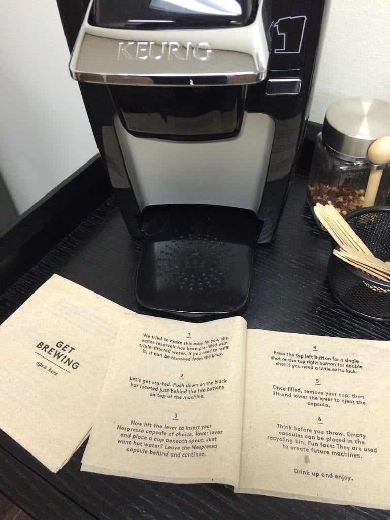 Front and middle panels of "instructional booklet" custom napkin, depicting how to use Keurig coffee maker