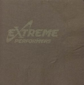 Example of metallic copper ink on a brown napkin, demonstrating poor color contrast