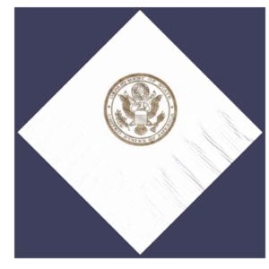 Gold ink "state department" emblem on white cocktail napkin