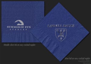 Navy napkin printed with silver ink next to a navy napkin embossed with silver foil